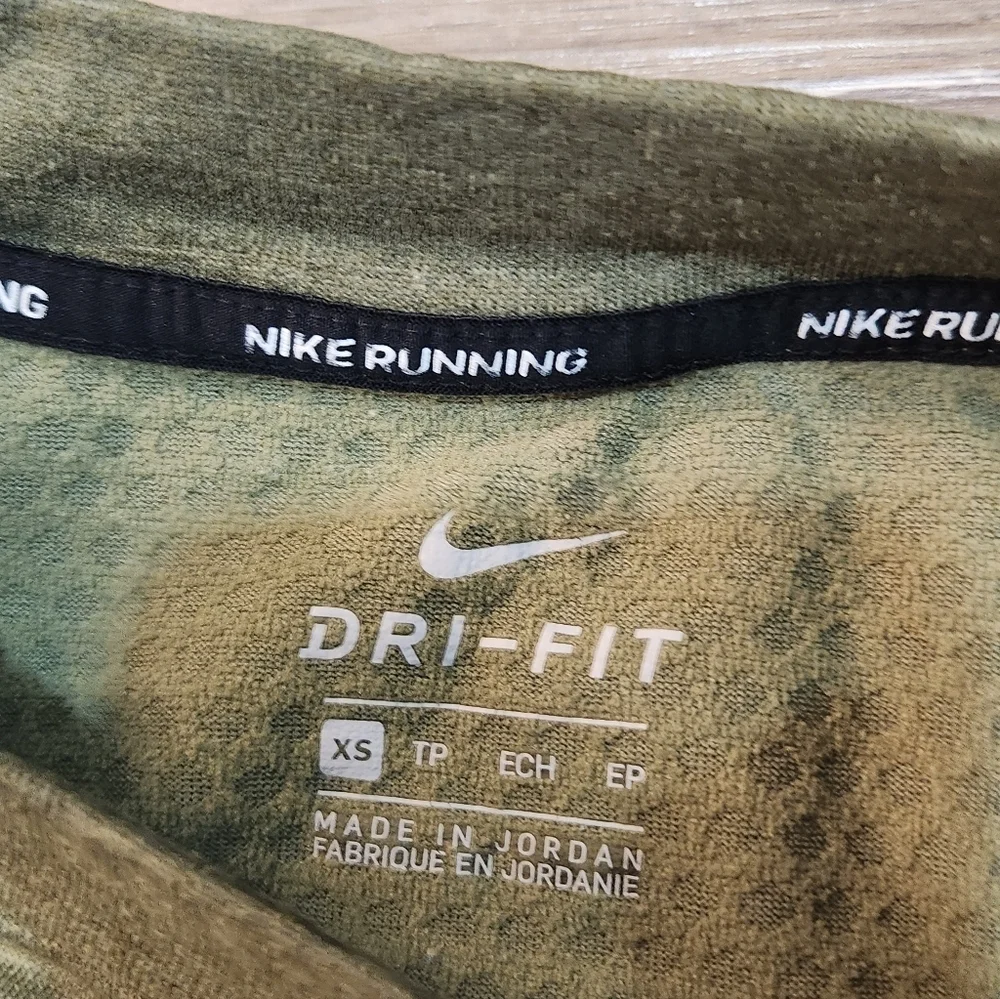 The Nike Running Women's Dri-Fit Crop Top Sweater in size Xsmall and olive green
